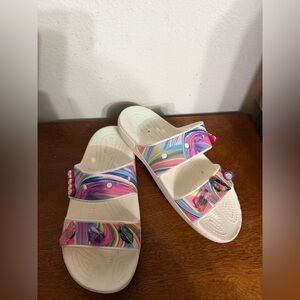 Crocs Classic Sandals featuring an 'Out of This World' swirl women’s 7 men’s 5